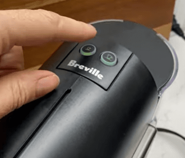 Press the button to turn Nespresso Pixie on